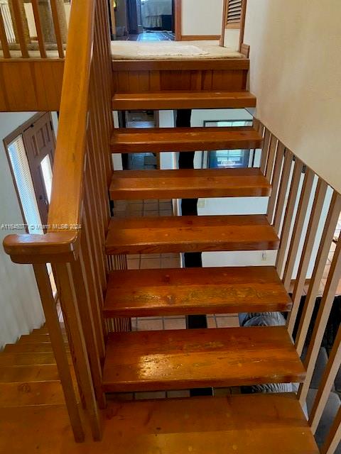 stairs with hardwood / wood-style flooring