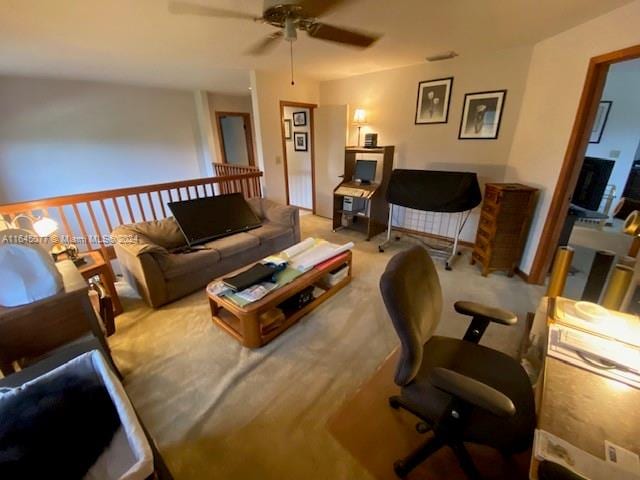 carpeted living room featuring ceiling fan