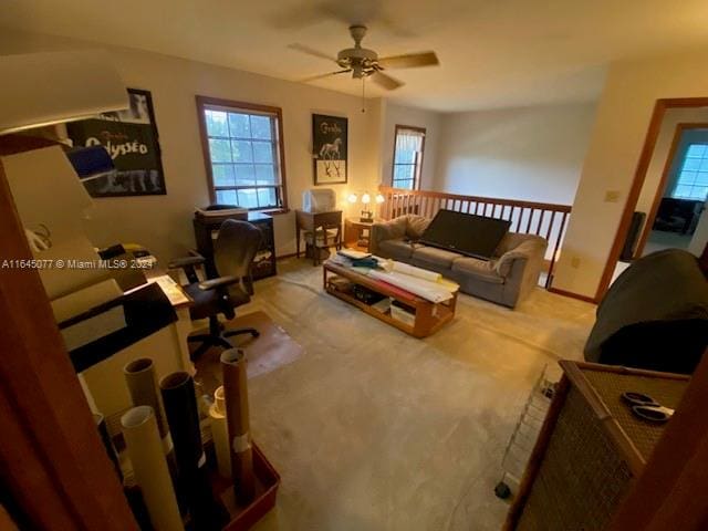 living room featuring ceiling fan and carpet flooring