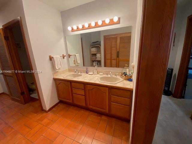 bathroom with tile patterned flooring and vanity