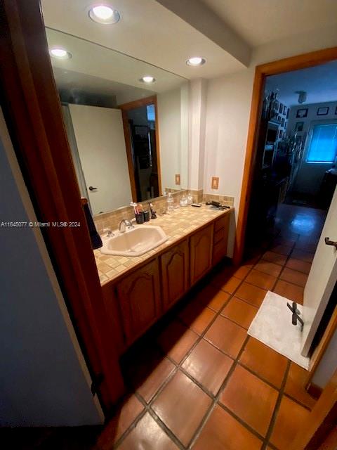 bathroom featuring tile patterned floors and vanity