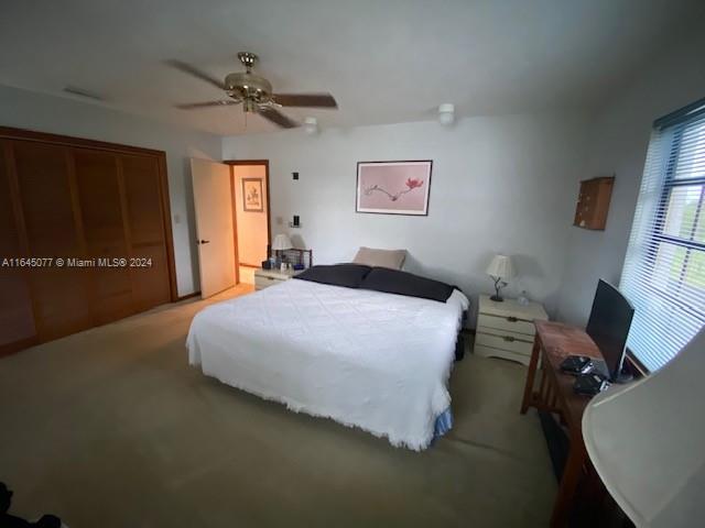 bedroom with carpet flooring and ceiling fan