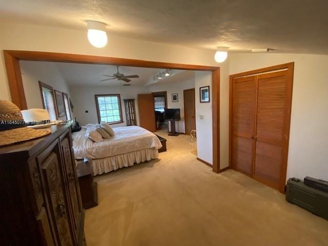 carpeted bedroom with ceiling fan