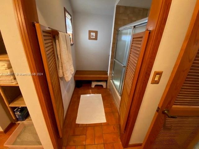 hallway with tile patterned floors