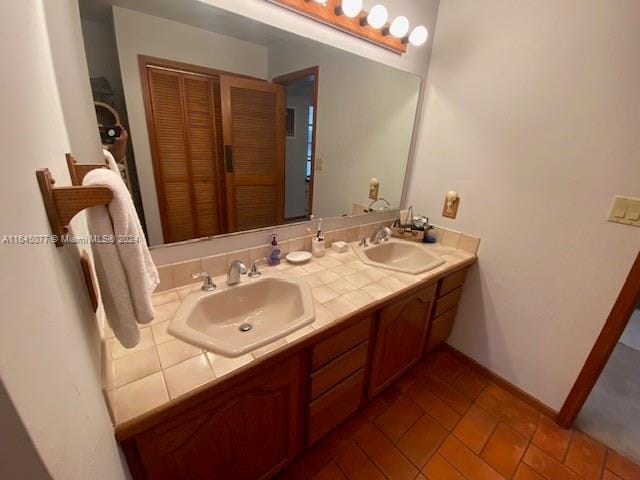 bathroom with tile patterned flooring and vanity