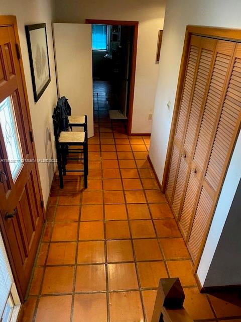 hallway featuring light tile patterned floors