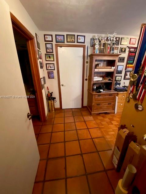 corridor featuring tile patterned floors