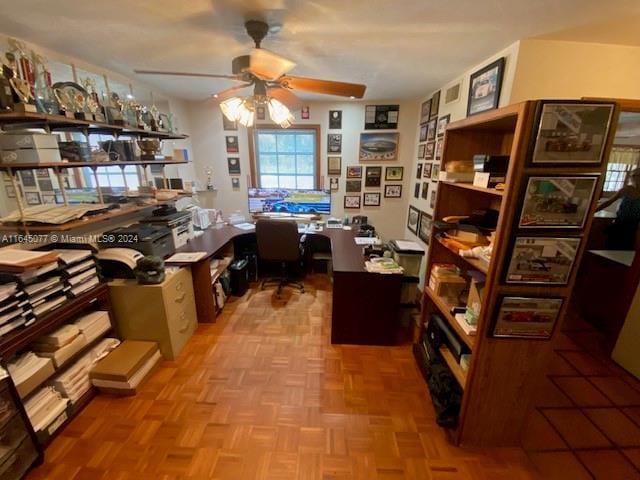 office area featuring ceiling fan and parquet floors