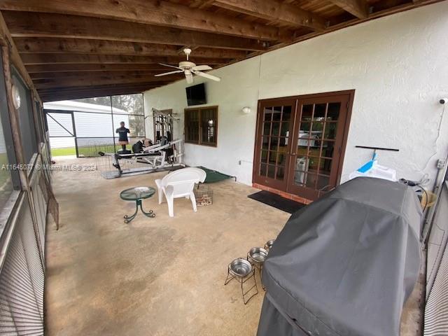 view of patio with ceiling fan, french doors, and area for grilling