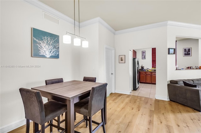 living room with crown molding and wood-type flooring