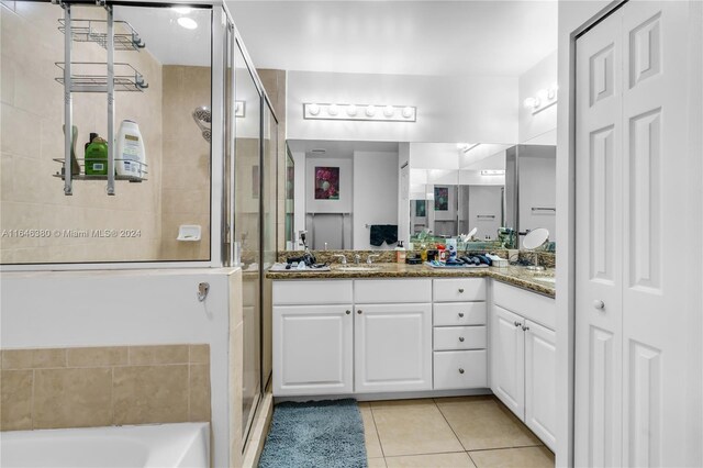 bathroom featuring tile patterned flooring, vanity, and independent shower and bath