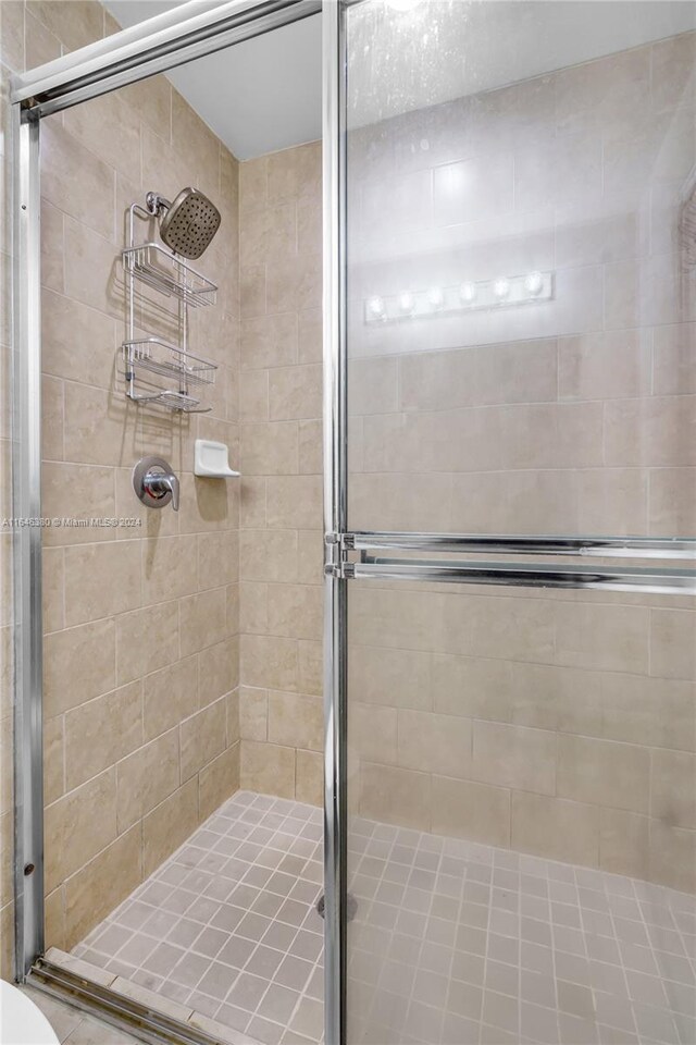 bathroom featuring an enclosed shower