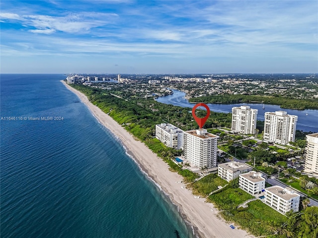 bird's eye view with a view of the beach, a water view, and a view of city