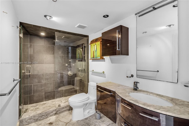 bathroom with toilet, a stall shower, visible vents, and vanity