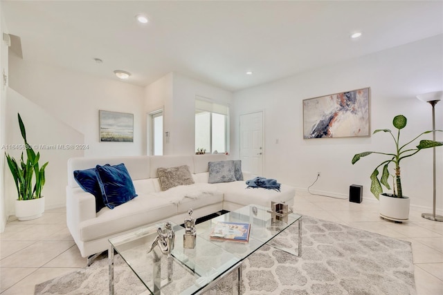 living area featuring recessed lighting and light tile patterned flooring