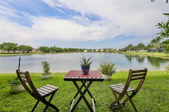 exterior space with a yard and a water view