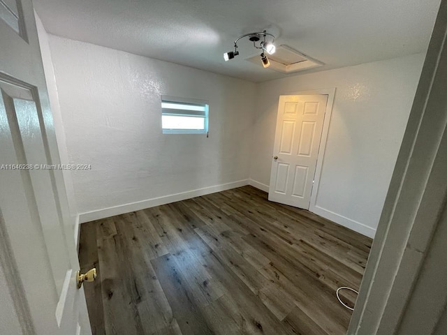 empty room featuring dark wood-type flooring