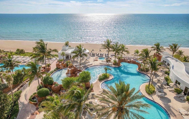 bird's eye view featuring a beach view and a water view