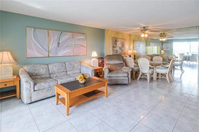 tiled living room featuring ceiling fan