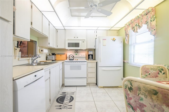 kitchen with white cabinetry, sink, light tile patterned floors, white appliances, and ceiling fan