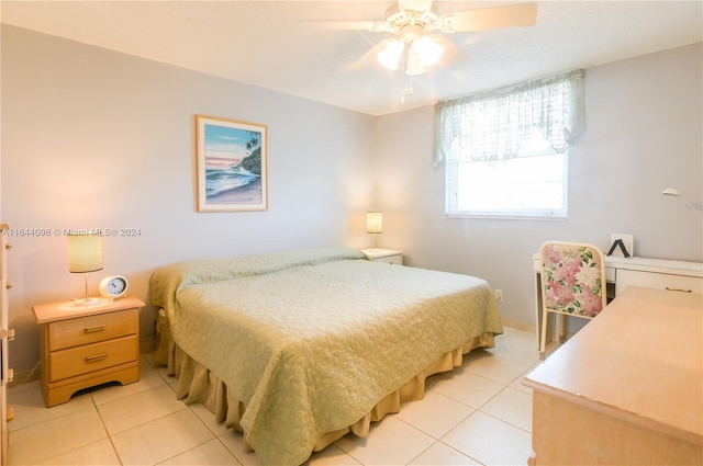 bedroom featuring ceiling fan and light tile patterned floors