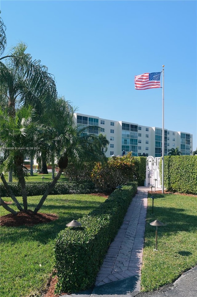 view of home's community with a lawn