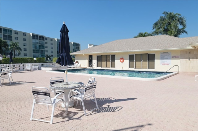 view of pool featuring a patio area