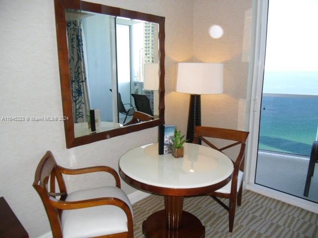 dining room with a water view