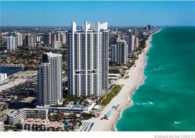 bird's eye view with a view of the beach and a water view