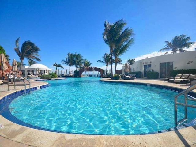 view of pool featuring a patio