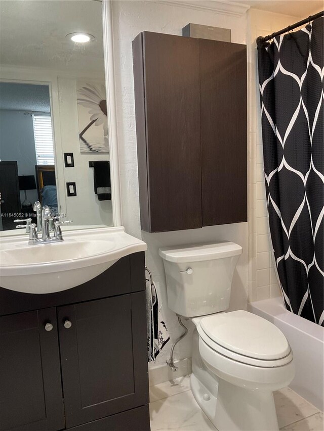 full bathroom with shower / tub combo, tile patterned flooring, toilet, and vanity