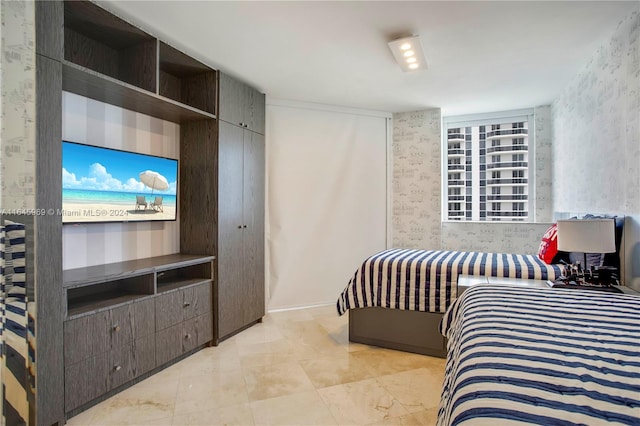 tiled bedroom featuring multiple windows