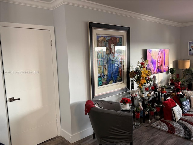 living room with dark wood-type flooring and ornamental molding