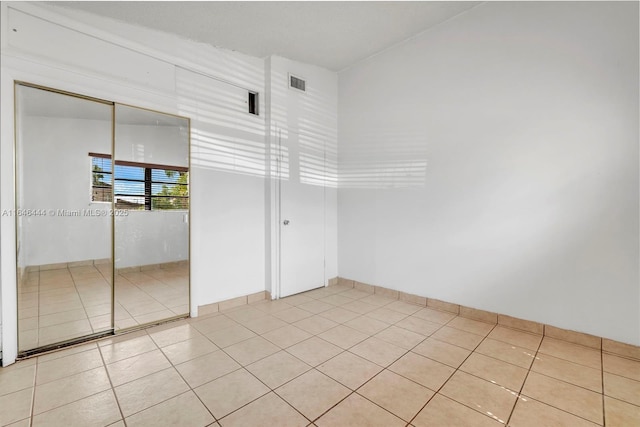 4296 E 9th Ln, Hialeah, FL 33013 - unfurnished room featuring light tile patterned flooring