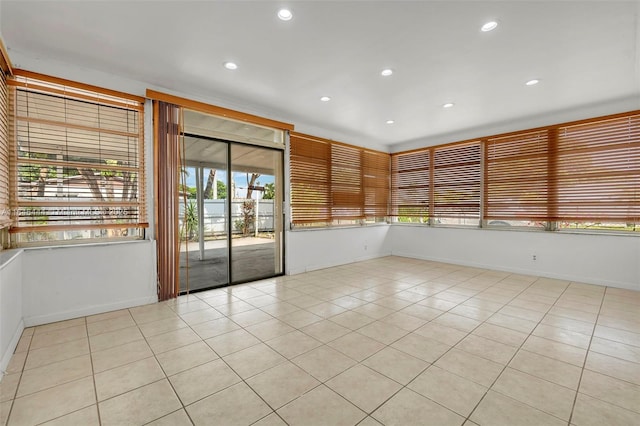 4296 E 9th Ln, Hialeah, FL 33013 - empty room featuring plenty of natural light, light tile patterned floors, and recessed lighting