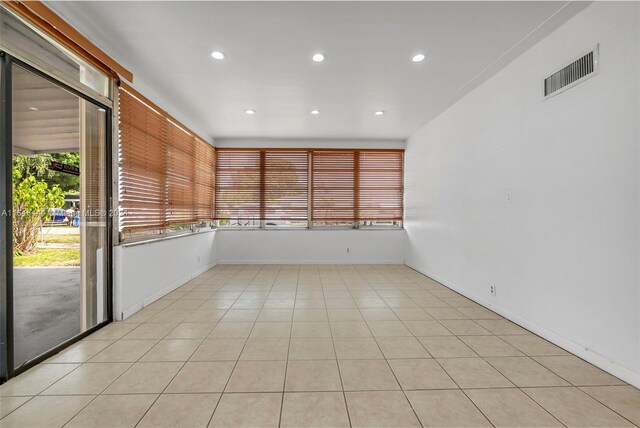 spare room with light tile patterned floors