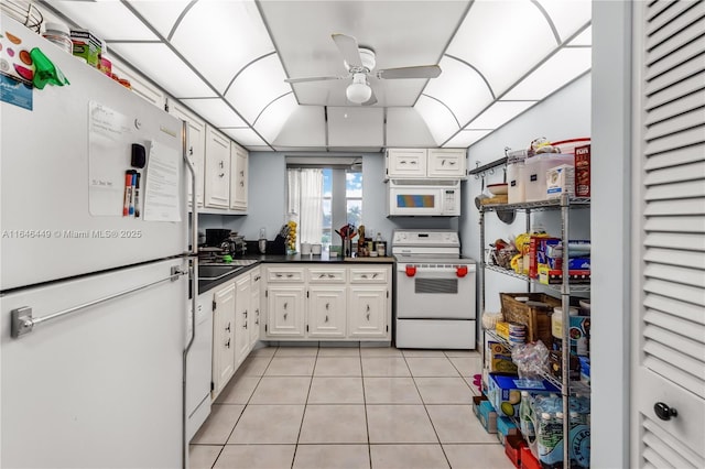 kitchen with ceiling fan, light tile patterned floors, white cabinets, and white appliances