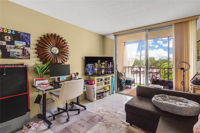 tiled home office with a textured ceiling