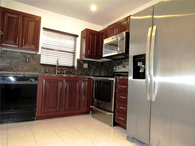 kitchen featuring light tile patterned floors, sink, stainless steel appliances, and decorative backsplash