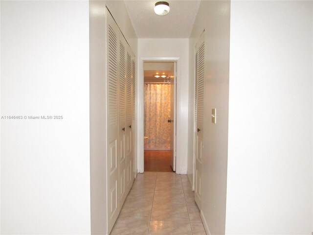 interior space featuring tile patterned floors and ceiling fan