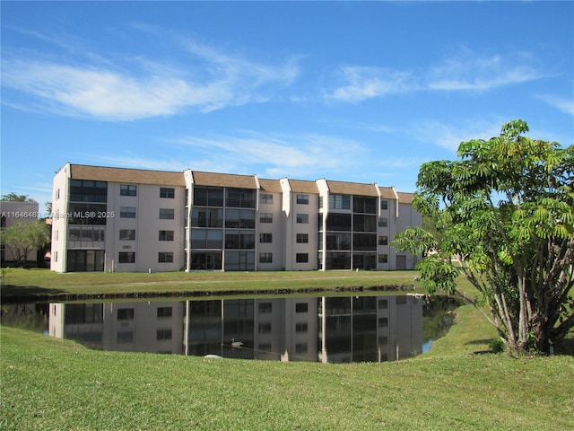 view of property with a water view