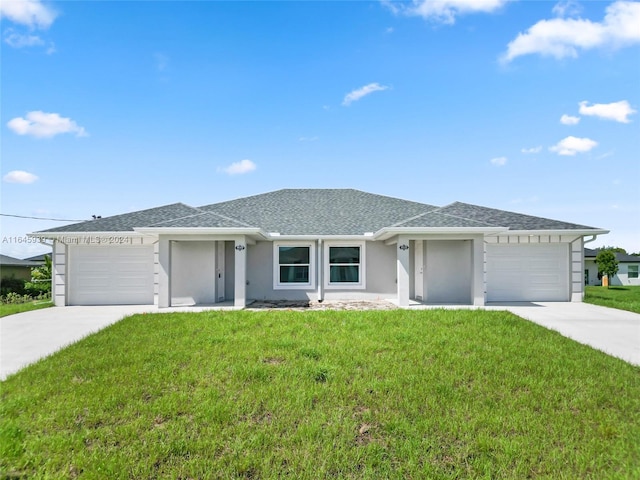 single story home featuring a garage and a front yard