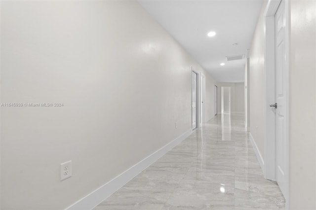 hall with light tile patterned flooring