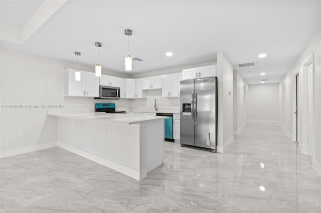 kitchen featuring white cabinetry, appliances with stainless steel finishes, light tile patterned floors, kitchen peninsula, and pendant lighting