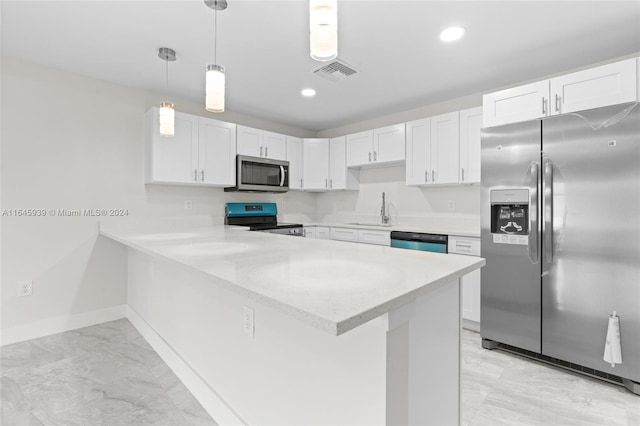 kitchen with stainless steel appliances, sink, white cabinets, light tile patterned floors, and kitchen peninsula