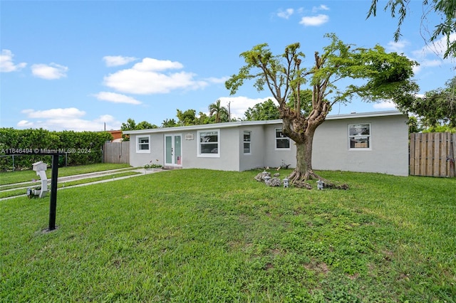 ranch-style home with a front yard