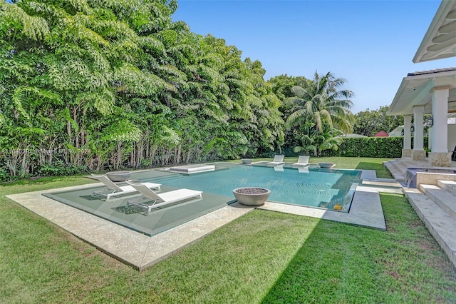 view of pool featuring a patio and a lawn