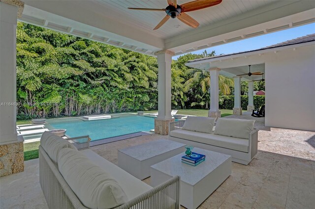 view of patio / terrace featuring ceiling fan and an outdoor living space