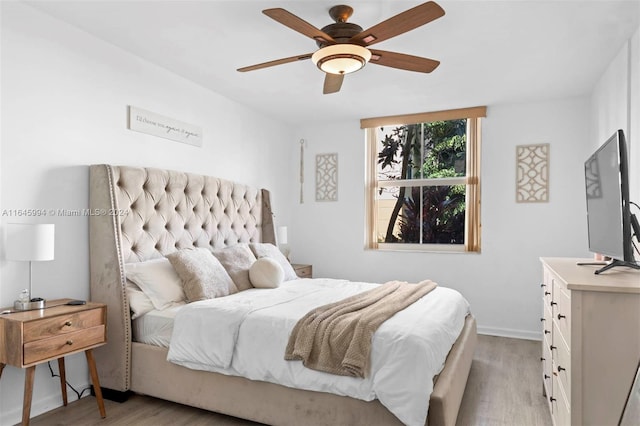 bedroom featuring ceiling fan and light wood-type flooring