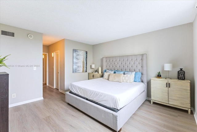 bedroom with light wood-type flooring